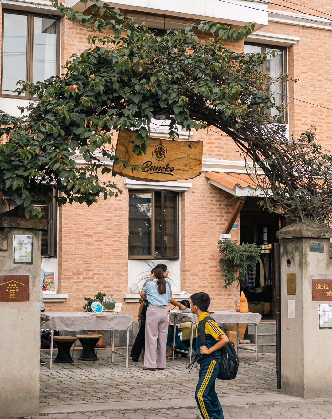 a boy returning from his school looking at the market